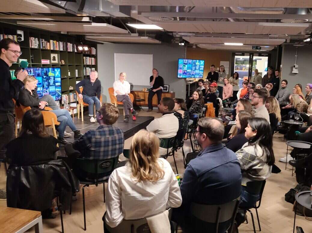 A picture from Tortoise's offices in London showing people gathered for its 2023 audio slate launch, illustrating a story about the company reporting a nearly £5m loss in 2022.