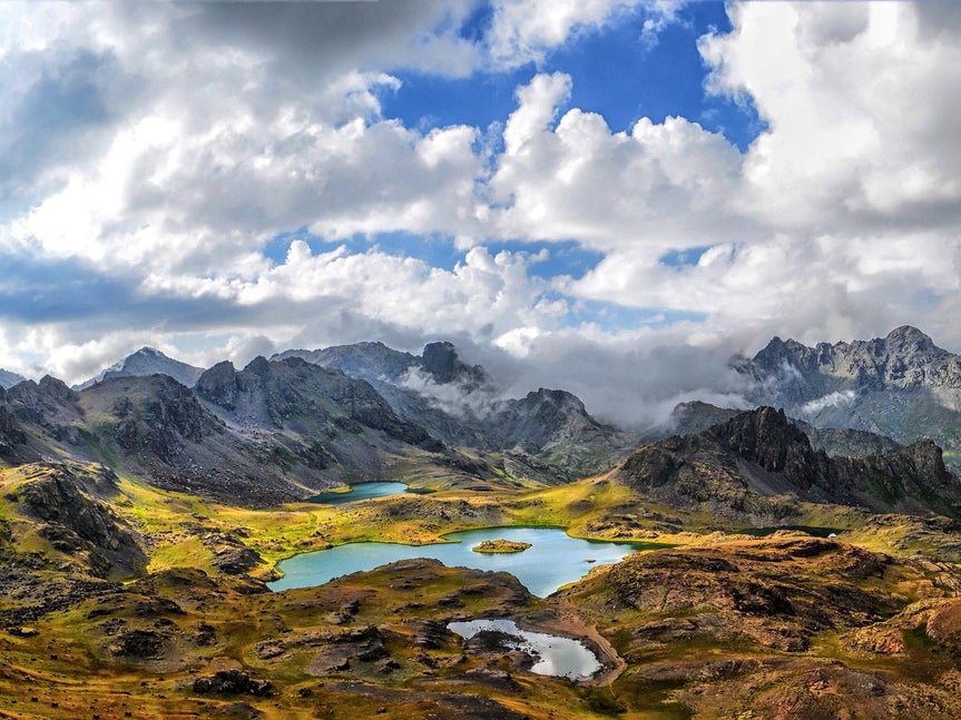 Mountain landscape with lakes and clouds before applying artsy effect